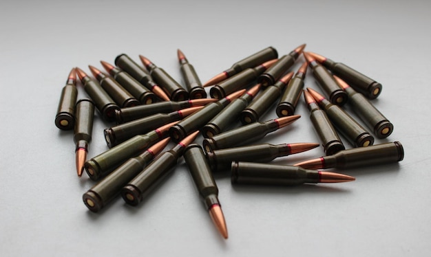 Live ammunition for assault rifle with red mark on a bullets studio isolated