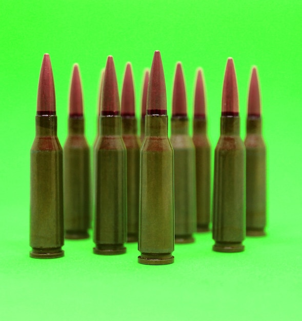 Live ammunition of rifle caliber on a green screen isolated