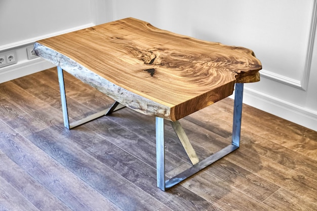 Live edge elm slab coffee table with bizarre pattern shape and tree rings on metal base