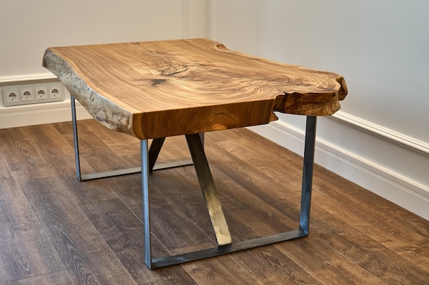 Live edge elm slab coffee table with bizarre pattern shape and tree rings on metal base