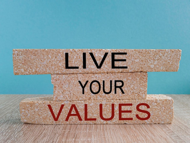 Live your values symbol Concept words Live your values on brick blocks Beautiful wooden table