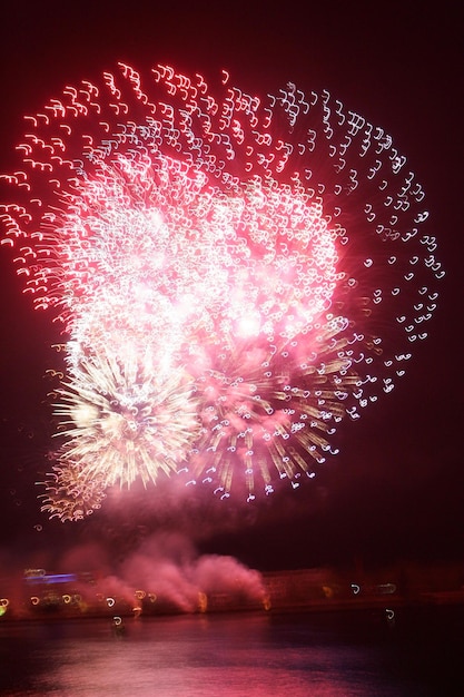 Lively multi-colored fireworks on black background