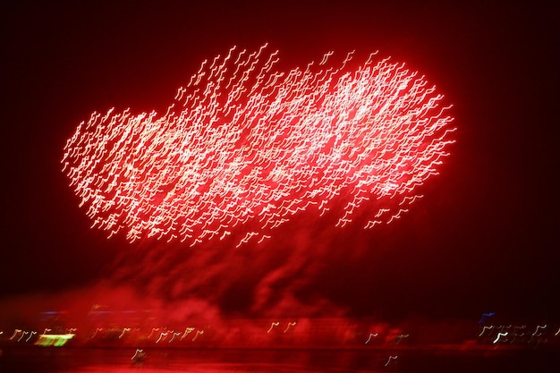 Lively multi-colored fireworks on black background