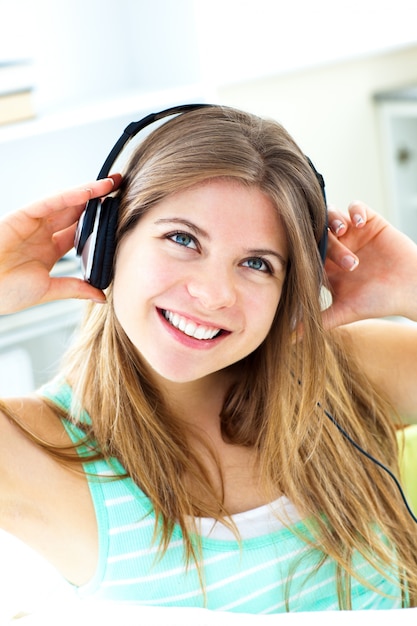 Photo lively young woman listen to music