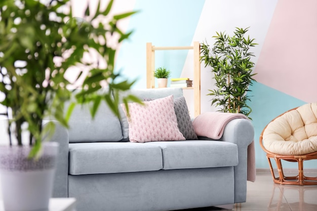 Living room interior with comfortable couch and soft pillows