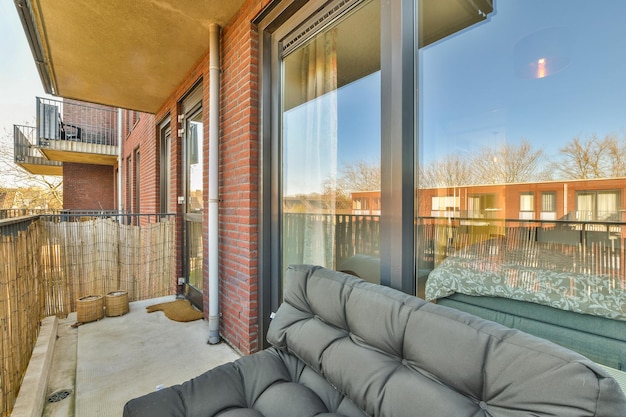 A living room with a couch and a large window