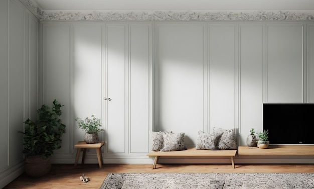 A living room with a couch and a plant on the wall