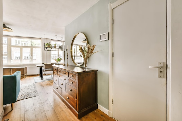 A living room with a dresser and a mirror