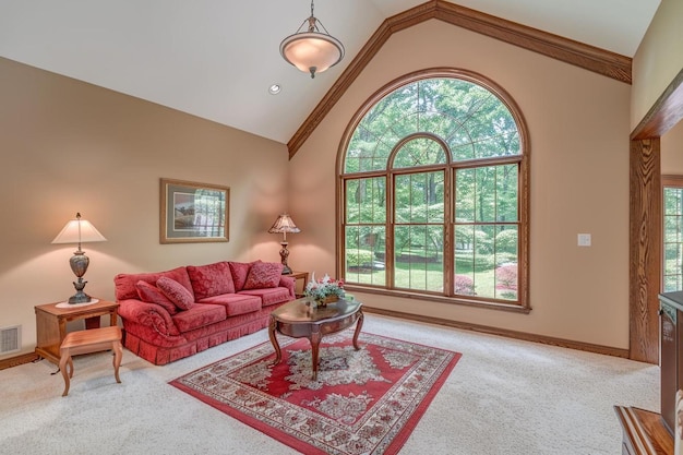 A living room with a red couch and a window