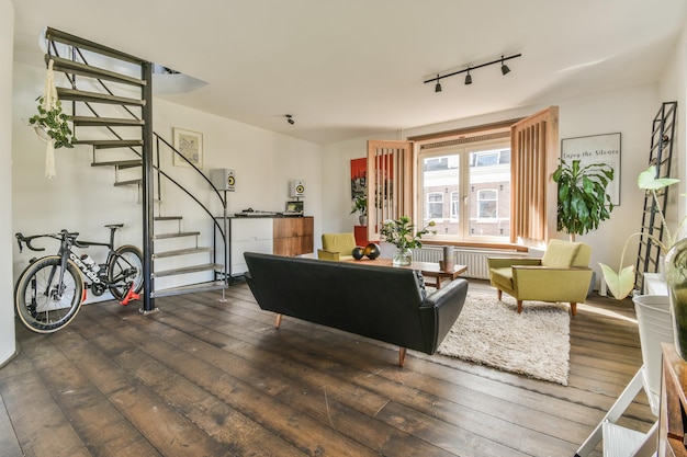 A living room with a spiral staircase and a couch