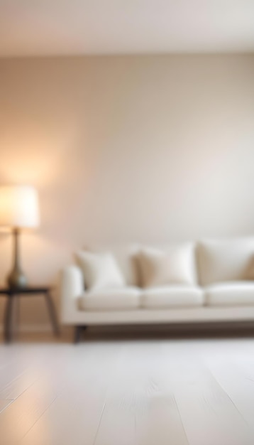 a living room with a white couch and a lamp on the table