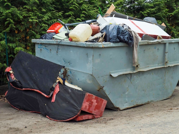 Loaded dumpster filled with rubble dumpster recycle waste and garbage