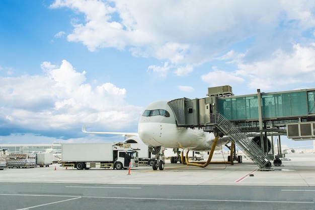 Loading cargo on plane in airport