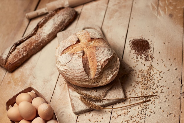 Loaf of bread on wooden background food closeup Bread at leaven Unleavened bread