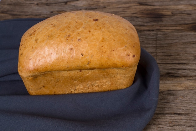 Loaf of onion bread on blue cloth