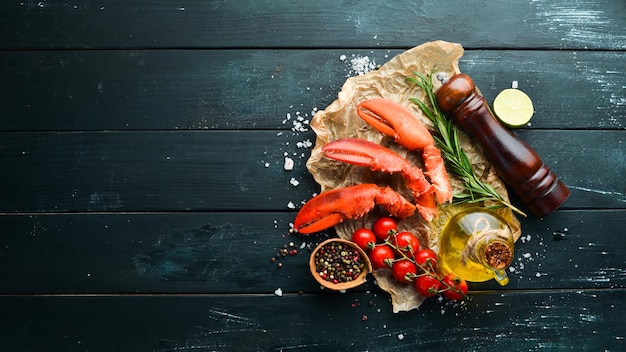 Lobster claws. Seafood on a black background. Top view. Free copy space.