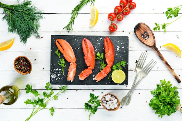 Lobster claws Seafood on a white wooden background Top view Free copy space