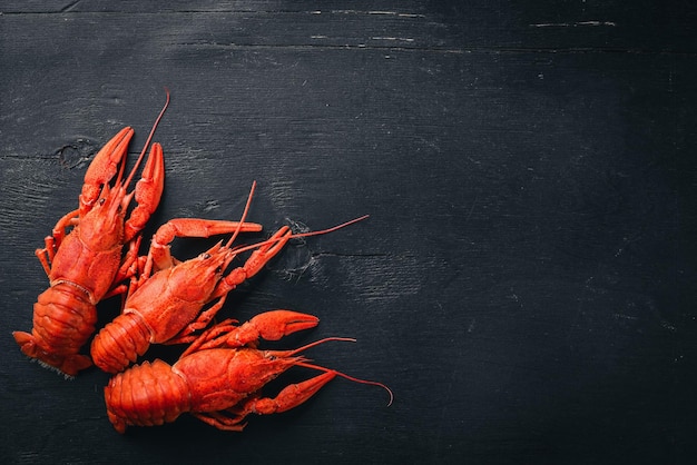 Lobster Seafood On a wooden background Top view Free space for your text