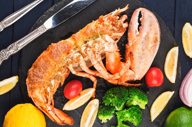 Lobster Thermidor grilled lobster stuffed with cream and cheese served with lemonBoston lobster w