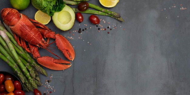 Lobster with vegetables and spices on grey concrete table Seafood and vegetables Healthy food Luxury food