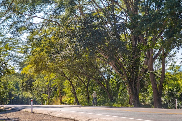 A local cyclist with a hat on the roads of Copan Ruinas Honduras