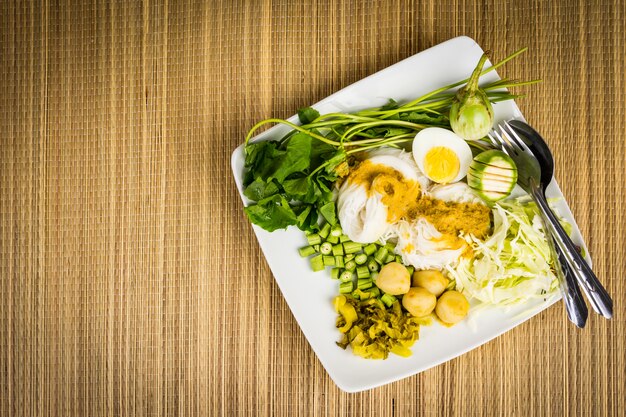 Local Rice vermicelli and curry sauce with vegetable (Kanom Jeen Nam Ya)