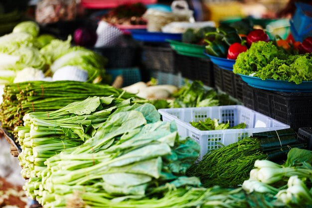 Local Thai vegetable stall A stall in a Thai fresh food market packed with fresh green vegetables