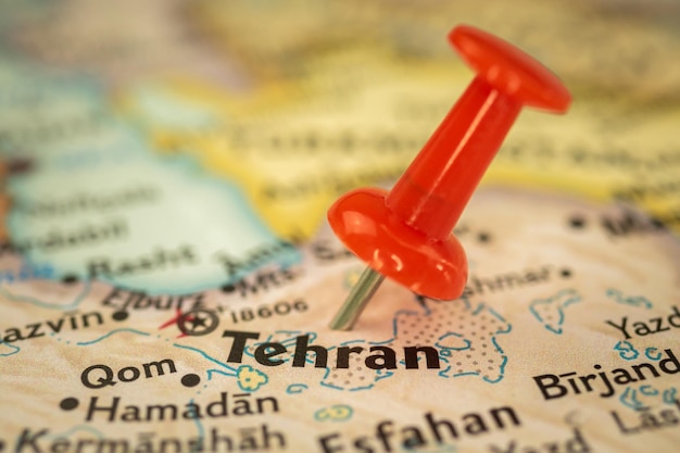 Location Tehran in Iran travel map with push pin point marker closeup Asia journey concept