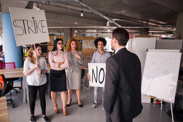 Loft style modern office, employees striking.