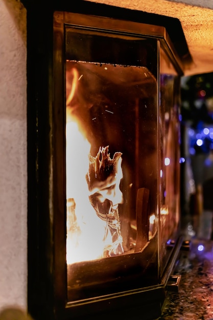 Log of wood burning in a fireplace inside a house hearth