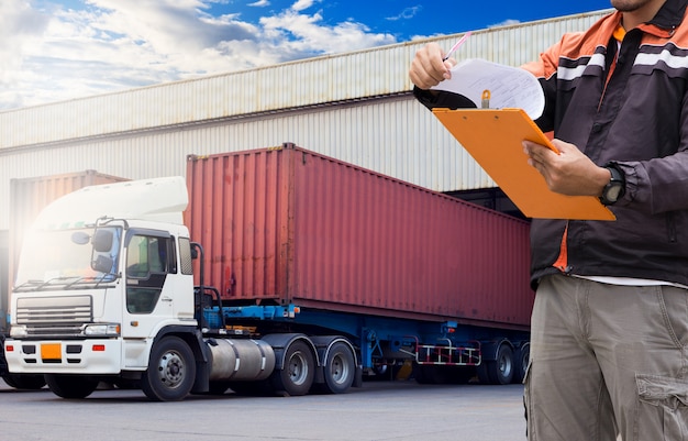 Logistic and Warehouse. Warehouse loader are holding a clipboard 