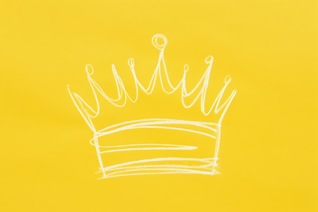 Logo icon or drawing of a royal golden crown on a yellow background illustration with space for text