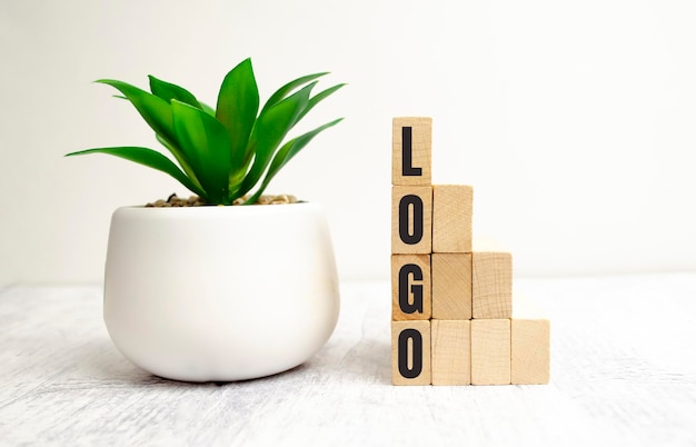 Logo written on a wooden cube in a office desk