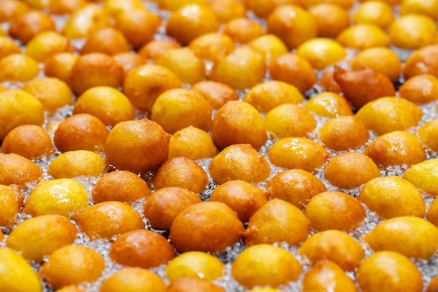 Lokma Turkish dough balls fried in boiling oil selective focus