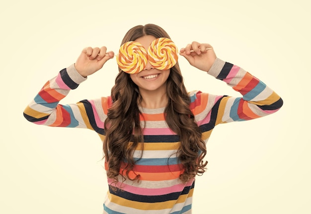 Lollipop child kid in colorful sweater hold lollypop sugar candy on stick caramel candy shop