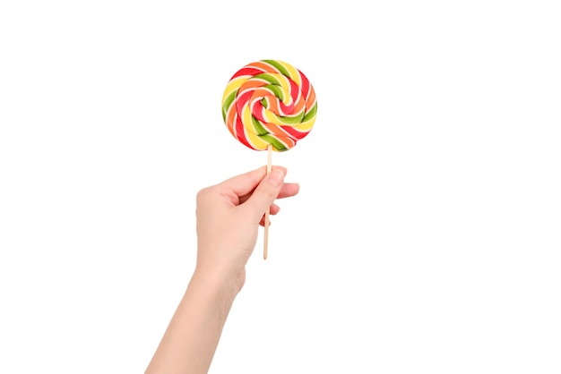 Lollipop in female hand isolated on white  background