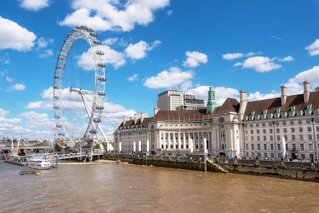 London skyline. London eye and river thames pier, from westminster bridge. 