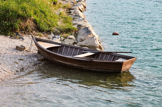 Lonely boat parked on Santa Croce Lake