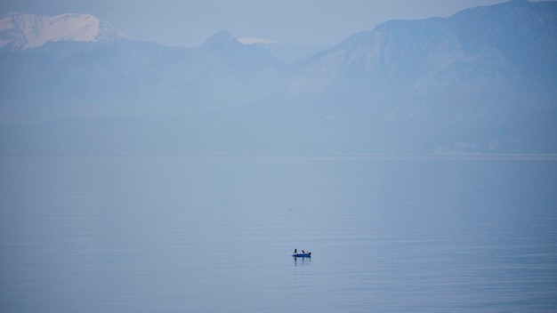 A lonely fishing boat in the middle of the sea