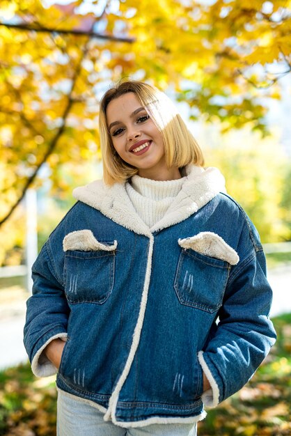 Lonely woman walk alone at autumn park lifestyle Beautiful fall nature