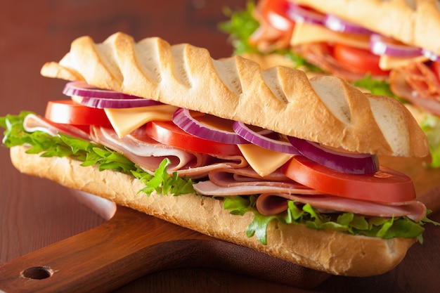 Long baguette sandwich with ham cheese tomato lettuce