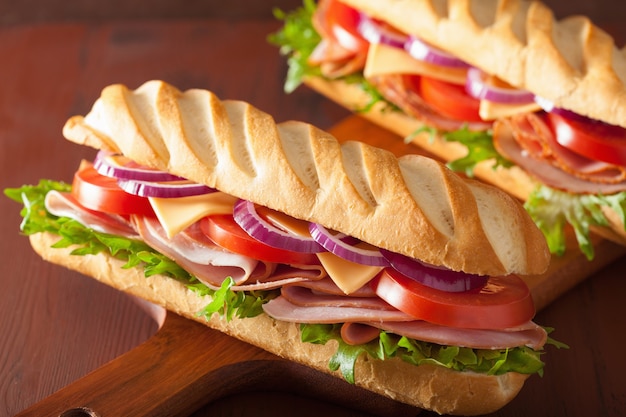 Long baguette sandwich with ham cheese tomato lettuce