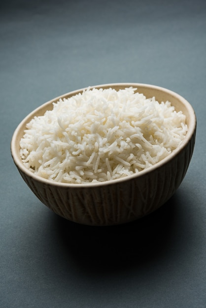 Long Basmati Rice in cooked form is an Indian main course food, served in a bowl. selective focus