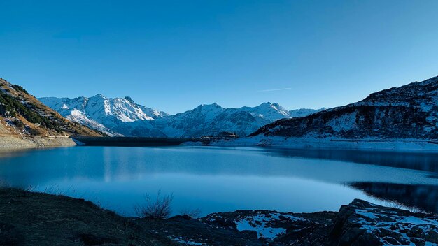 Long exposure of clouds with mountain alps in the background