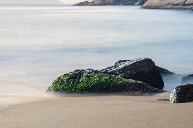 Long exposure details of the red beach of Urca in Rio de Janeiro Brazil