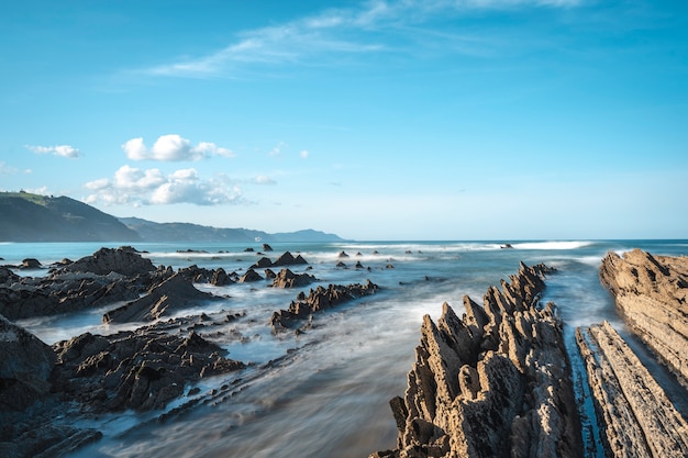 Long exposure Geopark in Sakoneta on the coast of Deba among rocks. Basque Country