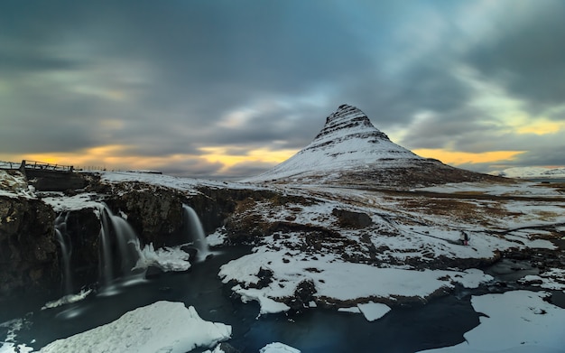 Long exposure of  mountain with waterfall  foreground in winter