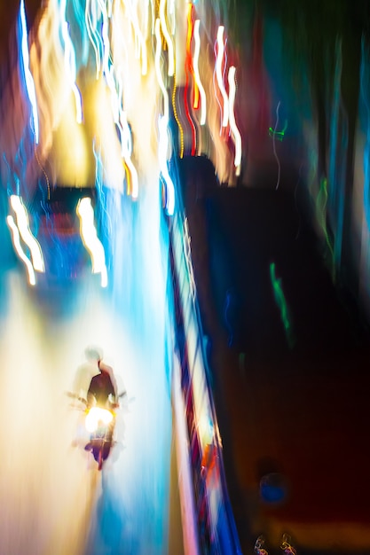 Long exposure night time traffic trails with vibrant neon colors