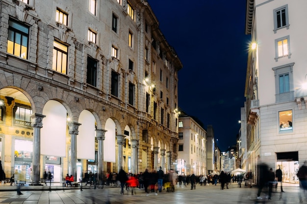 Long exposure of xmas shoppers at Corso Vittorio Emanuele ii near Duomo in Milan Lombardy Italy on a cold November night