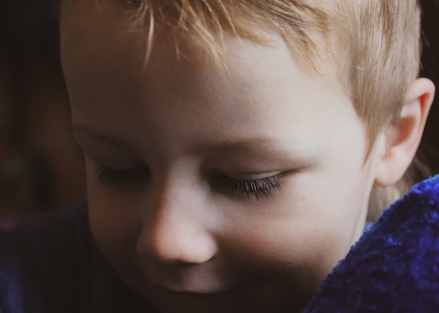 Long eyelashes of little boy close up